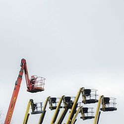 Low angle view of crane against clear sky