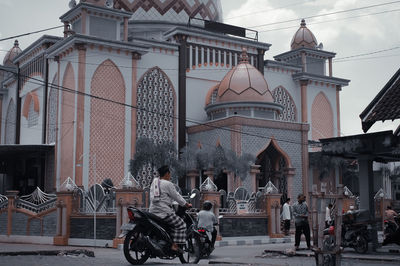 Bicycles against buildings in city