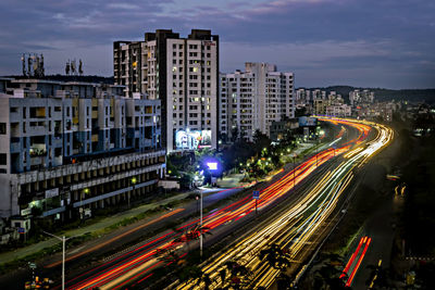 High angle view of light trails on road at night