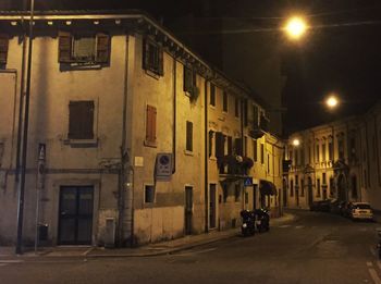 View of illuminated street lights at night