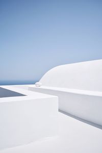 White colored footpath against clear blue sky