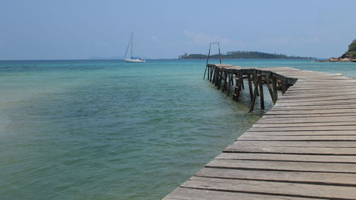 Pier over sea against sky