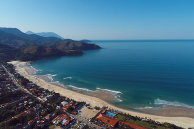 High angle view of sea against blue sky