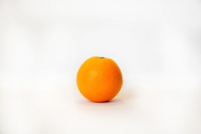 Close-up of orange on white background