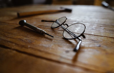 Close-up of key on wooden table