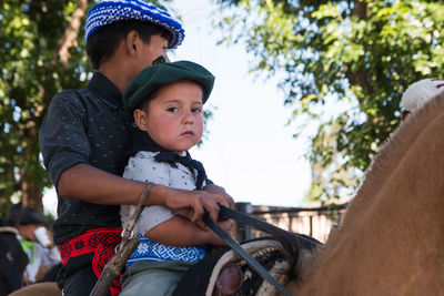 South american boys wearing traditional clothing