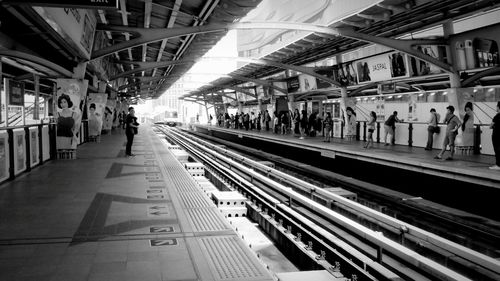 People waiting at railroad station platform