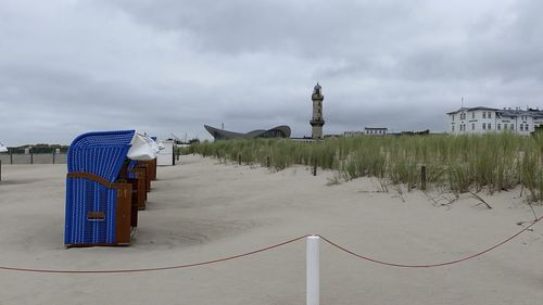 Built structure on beach against sky