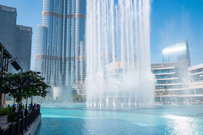 Low angle view of fountain in city