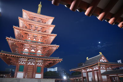 Low angle view of illuminated temple against sky at night