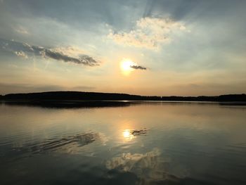 Scenic view of lake at sunset