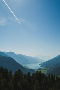 Scenic view of mountains against clear blue sky