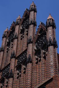 Low angle view of skyscrapers against sky