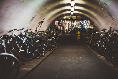Rear view of people in illuminated building