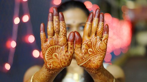 Close-up of woman hand showing henna tattoo