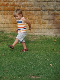 Full length of boy in grass