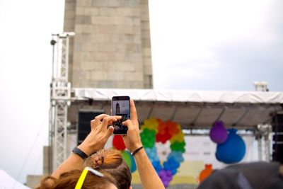 Man photographing with mobile phone