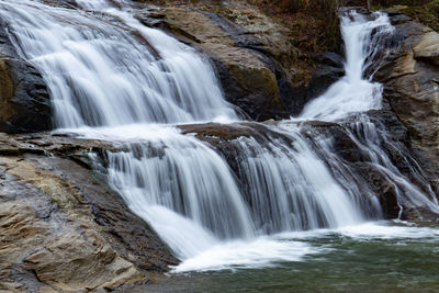 Scenic view of waterfall in forest