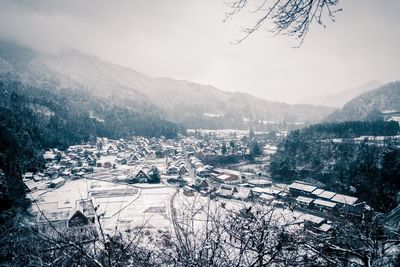 Aerial view of landscape against sky during winter