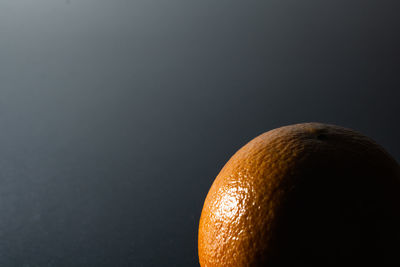 Close-up of orange over white background