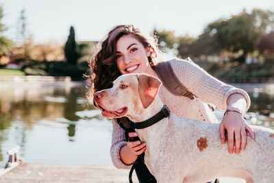 Portrait of young woman with dog