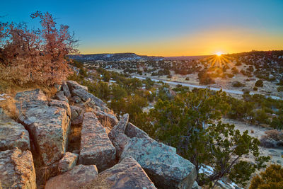 Scenic view of landscape against sky during sunset