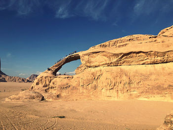 Rock formations on landscape against sky