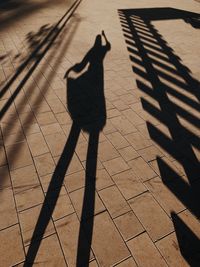 Shadow of man on street