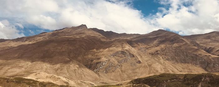 Panoramic view of rocky mountains against sky