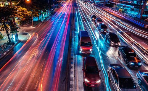 High angle view of light trails on highway at night