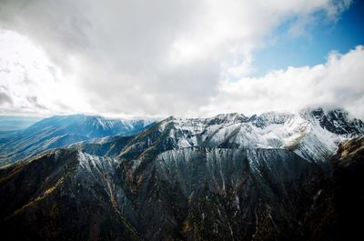 Scenic view of snowcapped mountains against sky