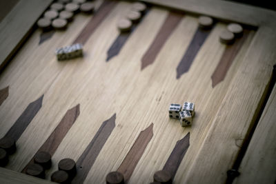 High angle view of piano keys on wooden floor