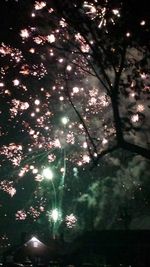 Low angle view of illuminated lanterns at night