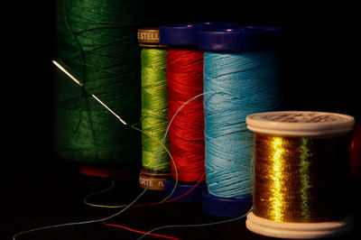 Close-up of multi colored candles on table