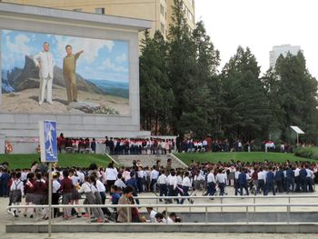People at town square against sky
