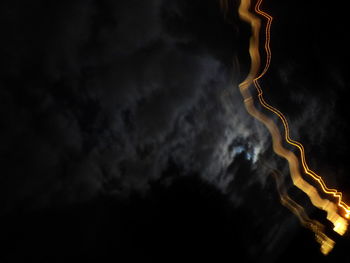 Low angle view of illuminated sky at night