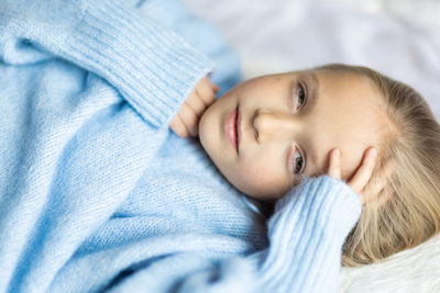 Portrait of cute baby boy sleeping on bed