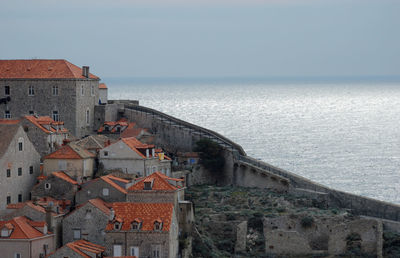 View of sea with buildings in background