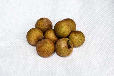 Close-up of eggs against white background