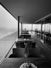 Empty chairs and tables in restaurant