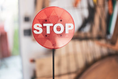 Close-up of road sign on footpath