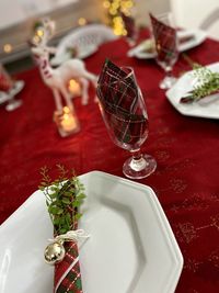 High angle view of wine in glass on table - merry christmas