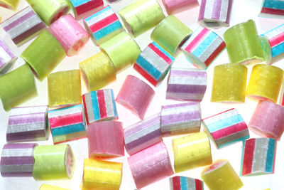 Full frame shot of multi colored candies on white background