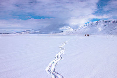 Footprints of man walking in the snow. mountain plain winter landscape