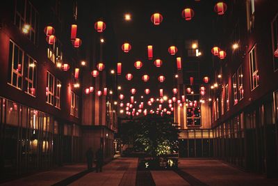 Illuminated lanterns in city at night