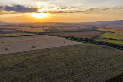 Scenic view of landscape against sky during sunset