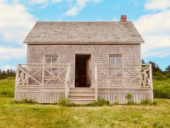 House on field against sky