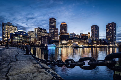 Illuminated buildings in city against clear sky boston skyline cityscape 