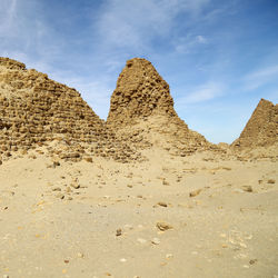 Panoramic view of desert against sky