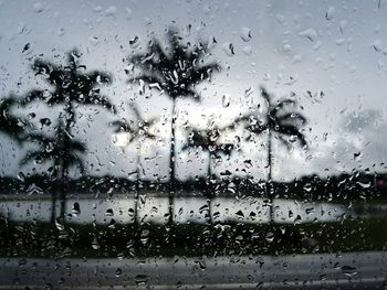 Full frame shot of wet glass window in rainy season